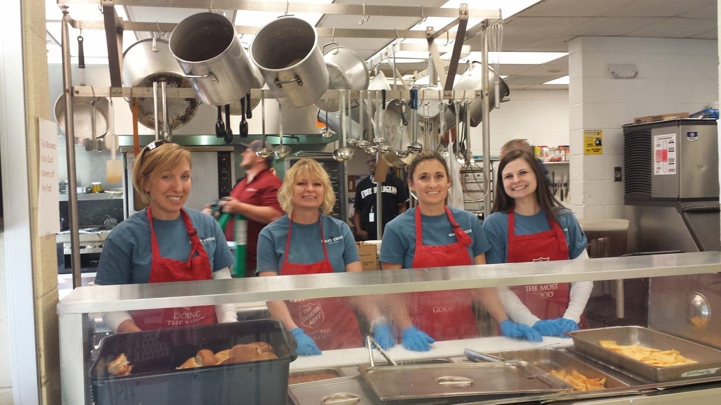 Four members of the Rocky Creek Dental Care team volunteering at a food pantry in Greenville and Greer, SC
